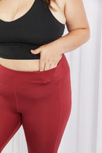 Load image into Gallery viewer, Yelete Ready For Action Full Size Ankle Cutout Active Leggings in Brick Red
